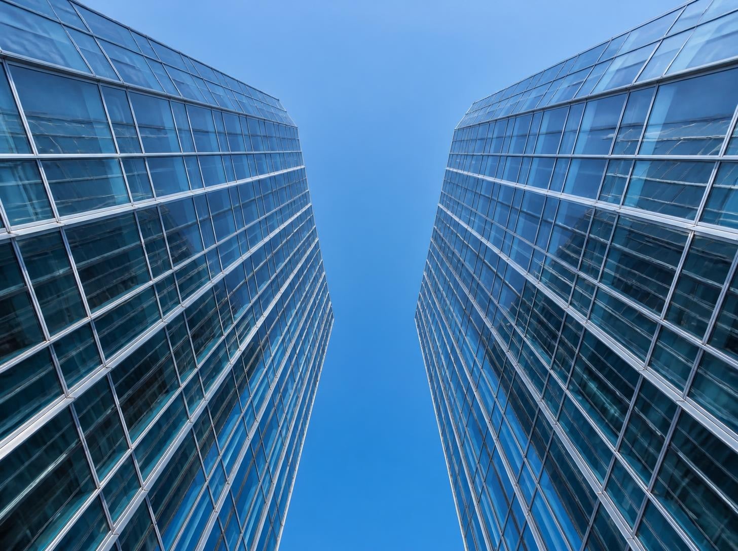 Glass curtain wall towers seen from below